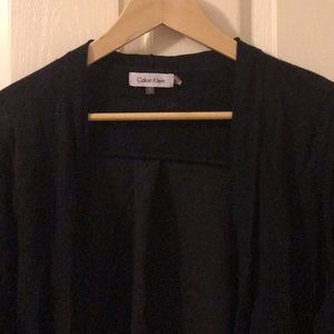 Black open front sheet sweater